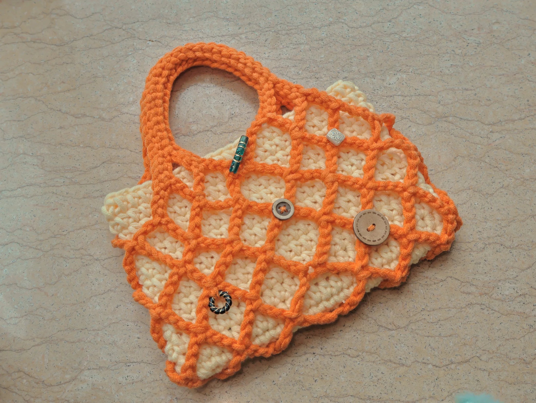 Orange lattice bag photographed from above